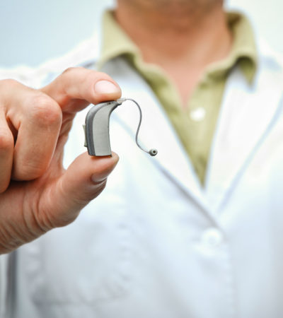 Doctor showing a hearing aid
